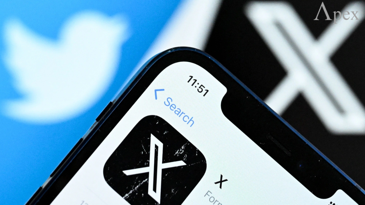 Twitter rebranded to X Close-up of a smartphone showing the X app icon in the store, with the old Twitter bird logo blurred in the background.